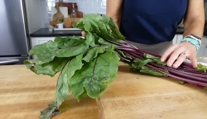 Trim the stems and leafy greens from the beets. If not using immediately, store beets and greens separately in airtight containers to prevent the greens from drawing nutrients from the beets.