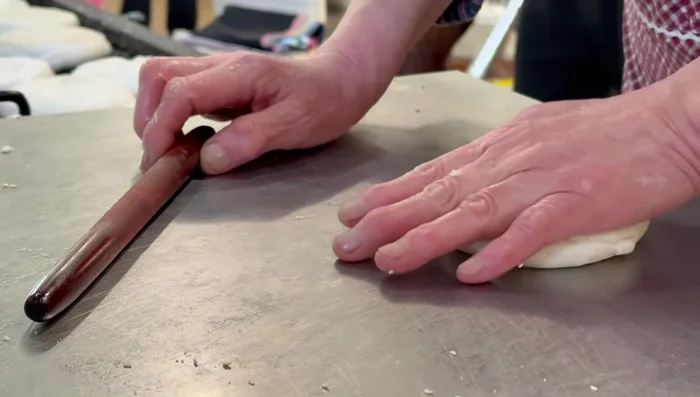 After the fermentation process is complete, prepare the dough for the Shaobing. Roll out the dough.