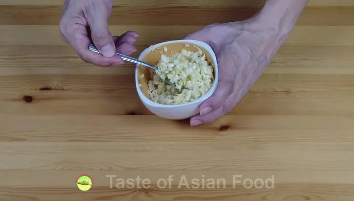 Deep fry the garlic: Coarsely chop the garlic. Heat oil in a wok over low to medium heat. Deep fry the garlic until golden brown (5-8 minutes), stirring occasionally for even cooking. Remove and drain on a strainer.