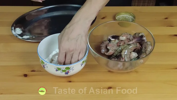 Coat the shrimp in cornstarch: Toss the marinated shrimp in cornstarch, ensuring it coats the entire shrimp. Shake off any excess cornstarch.