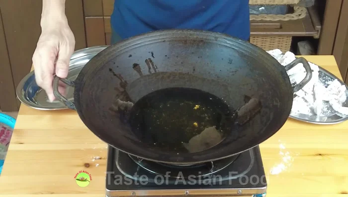 Deep fry the shrimp (first fry): Fry the shrimp in batches in the same oil used for garlic, at medium heat until the color changes. Remove and set aside.