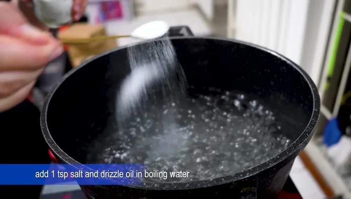 Boil potatoes for 10 minutes with salt and olive oil. Drain and place on the baking tray.