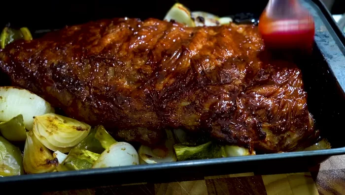 Brush Leami's spare rib sauce onto both sides of the ribs and bake for 5 minutes per side.