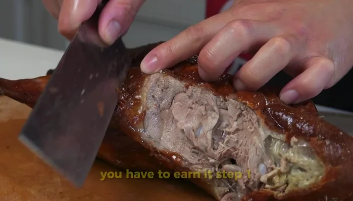 Inflate the duck using a bicycle pump or thin metal tube to separate the skin from the meat. (180.08)