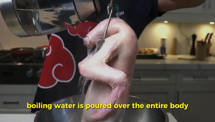 Pour boiling water over the duck to tighten the skin. (224.4)