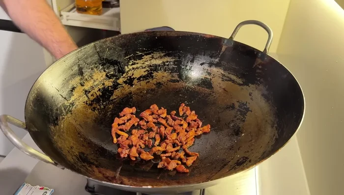 Add 1 teaspoon honey mixed with 1 tablespoon water to the pork. Quickly blast over high flame until the water's gone (about 15 seconds). Remove and drain on paper towels.