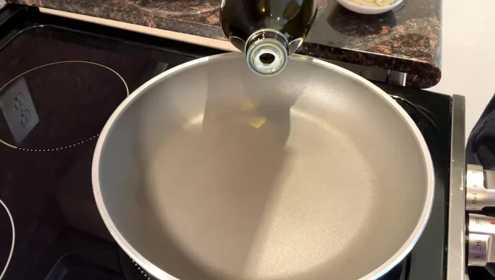 Add a small amount of cooking oil to the hot pan.