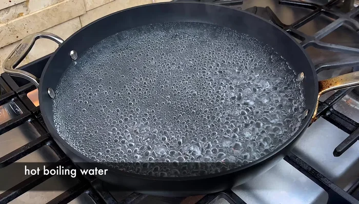 Boil water in a pot and cook the noodles until slightly soft. Gently break them apart and remove from the water.