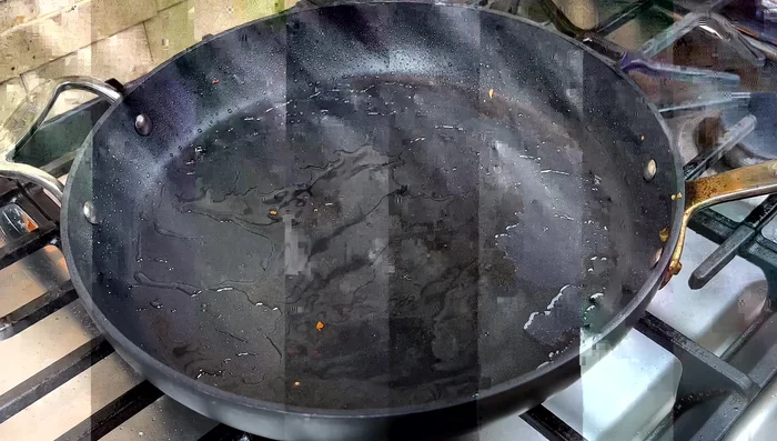 Add more oil to the pan if needed and stir-fry the cabbage and onion strips with salt and sugar. Add rice wine (optional).