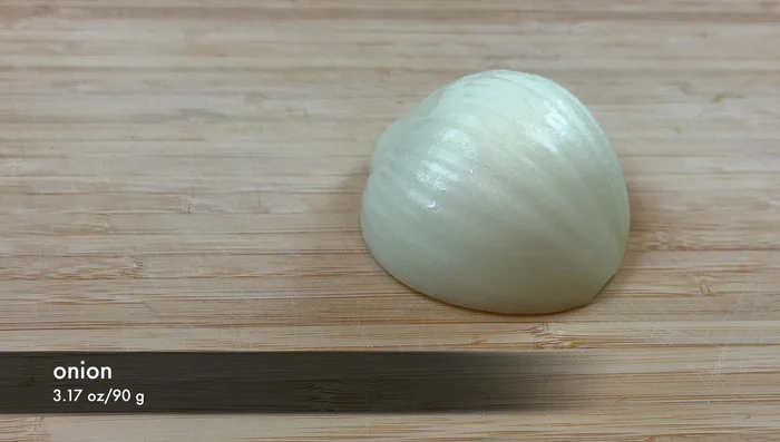 Cut the onion into strips, separating the layers.