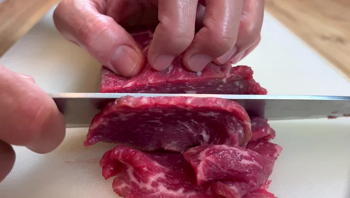 Cut the beef across the muscle fiber into slices.