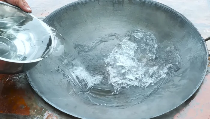 Prepare the pan and set it on the stove.