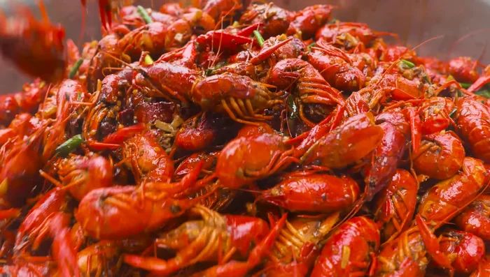 Serve the cooked crawfish on a plate.
