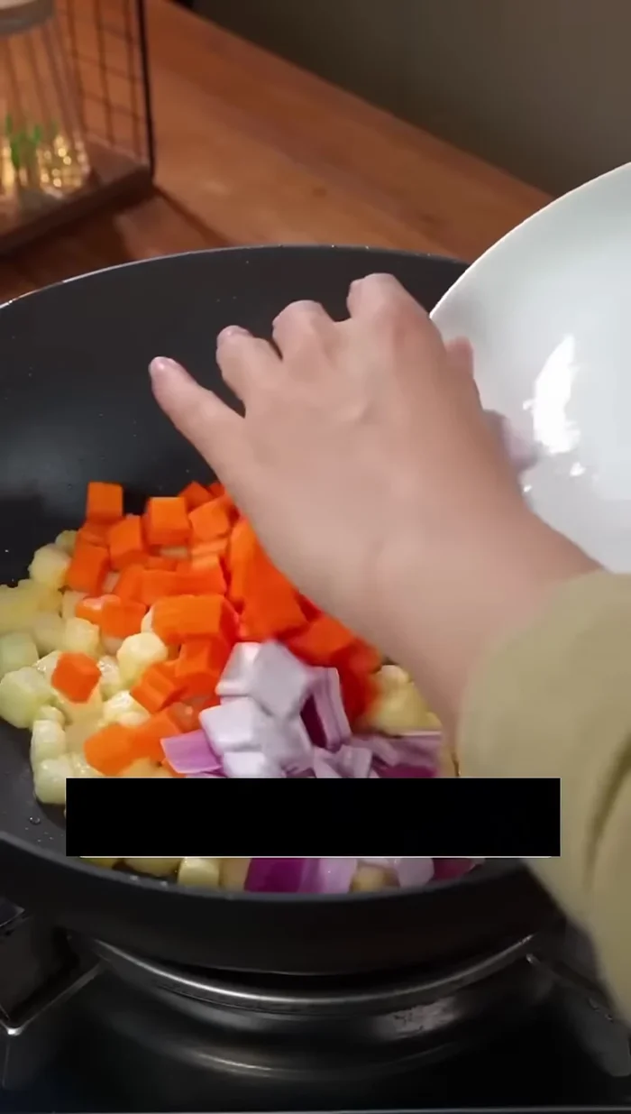 Add carrots and onions to the pan.