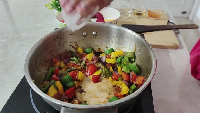 Add the corn flour slurry and stir until the sauce thickens.