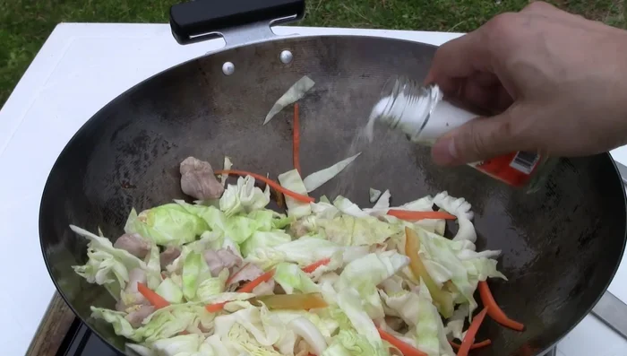 Add the marinated chicken and stir-fry until cooked through.
