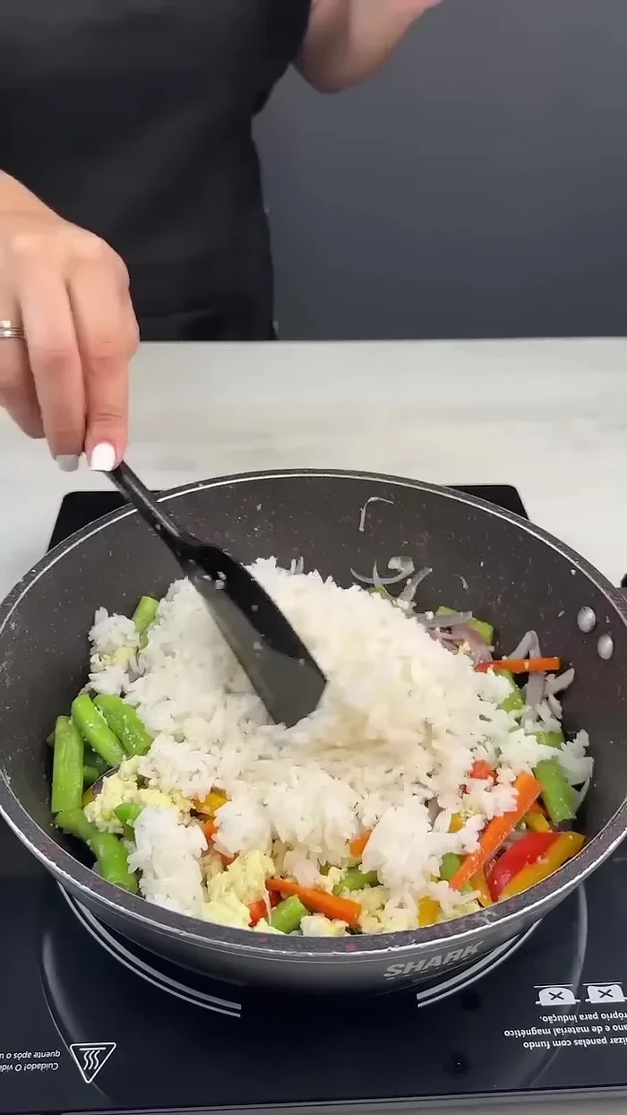 Add rice, salt, sugar, and soy sauce. Mix well.