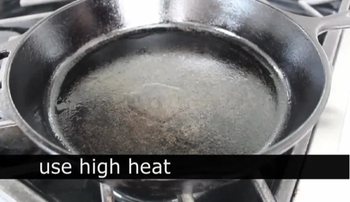 Cook the squid: Heat a cast iron skillet over high heat with a little vegetable oil until smoking. Add the squid in two batches, stir for 30 seconds to 1 minute until cooked through and slightly opaque. Remove from heat and transfer to a shallow dish. (203.159)