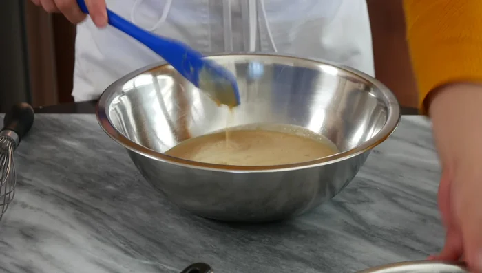 Gently whisk the dry ingredients into the strained yeast mixture until just combined. Do not overmix.
