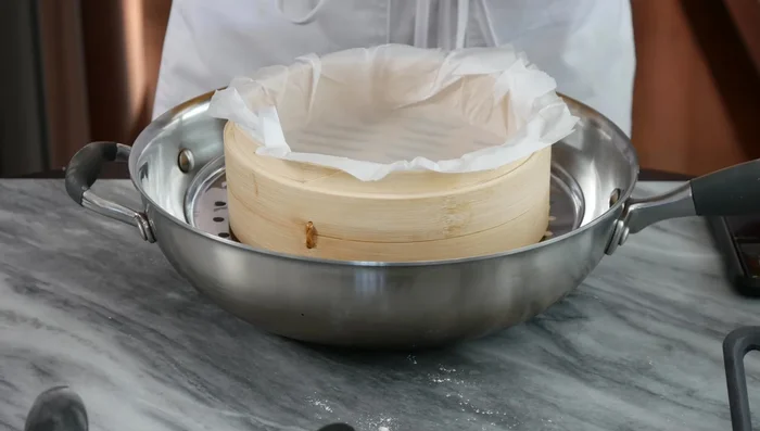 Pour the batter into the prepared steamer.