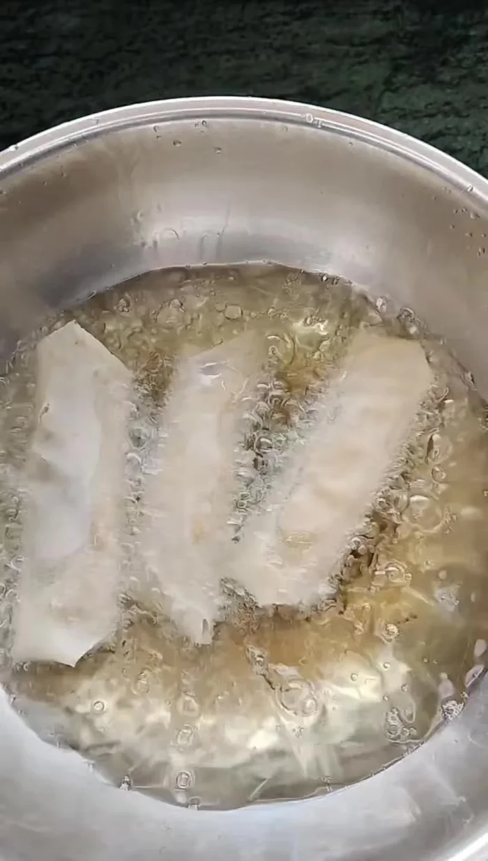 Heat oil in a pan and fry spring rolls until golden brown and crispy, turning occasionally.
