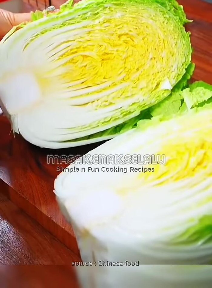 Cut the white mustard green in half, then into large pieces.