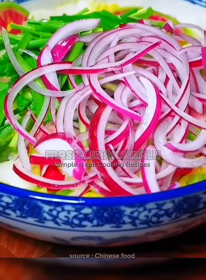 Add sliced onions and chopped chives.