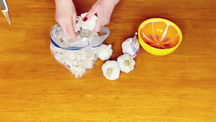 Peel the garlic cloves. You can save the peels for fertilizer.