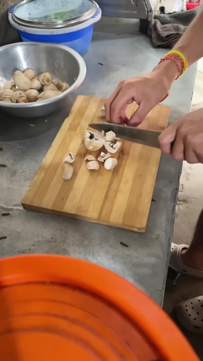 Coat the chopped mushrooms with cornflour, gradually adding water to help it stick.