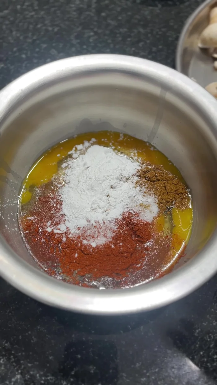 Add corn flour and maida (if available). Mix well until smooth.
