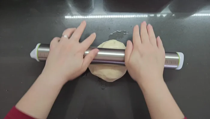 Roll out the dough: On an oiled surface, roll out the dough as thinly as possible (271.8s).