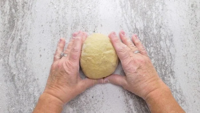 Form a firm yet pliable dough using flour, water, and salt. Knead for at least 10-15 minutes until smooth and elastic.
