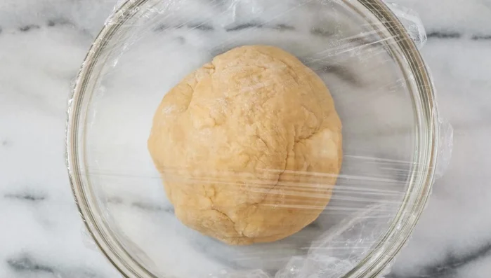 Let the dough rest, covered, for at least an hour to allow gluten development.