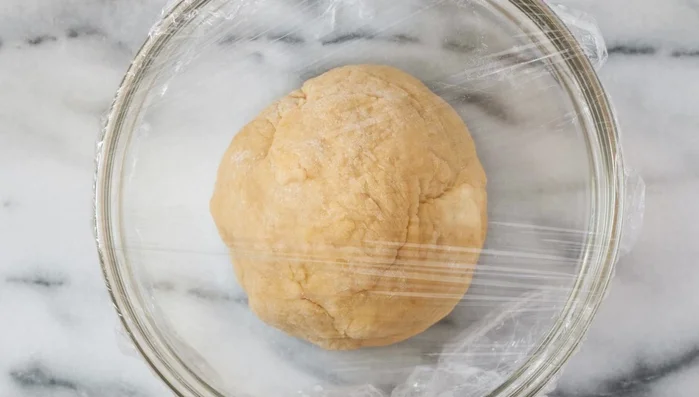 Divide the rested dough into manageable pieces.