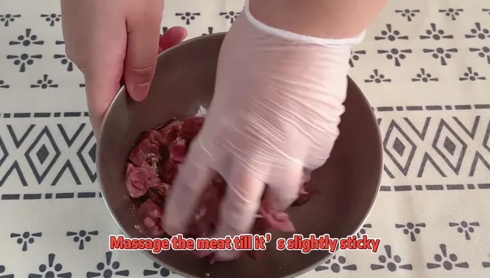 Cook the lamb: Roast cumin seeds until aromatic, then grind coarsely. Cook lamb in hot oil until color changes. Set aside.