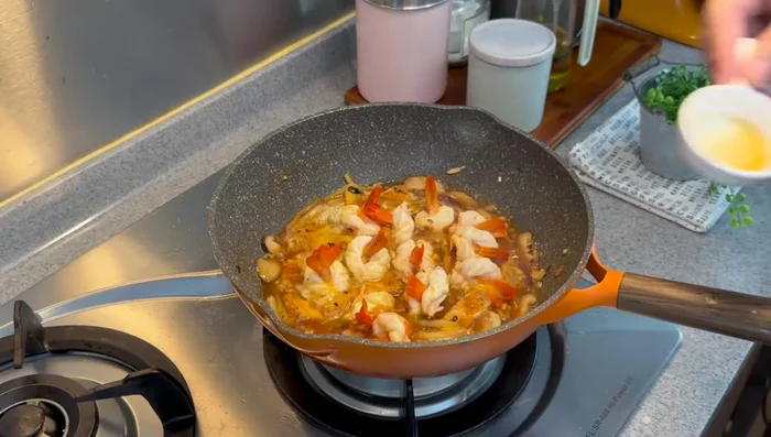 Add optional egg and cooking wine. Stir gently.