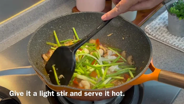 Add remaining spring onions, stir lightly, and turn off the heat.