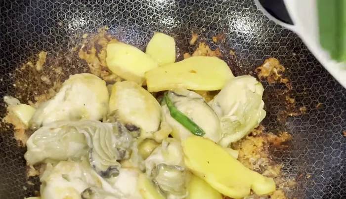 Add onions and stir-fry.