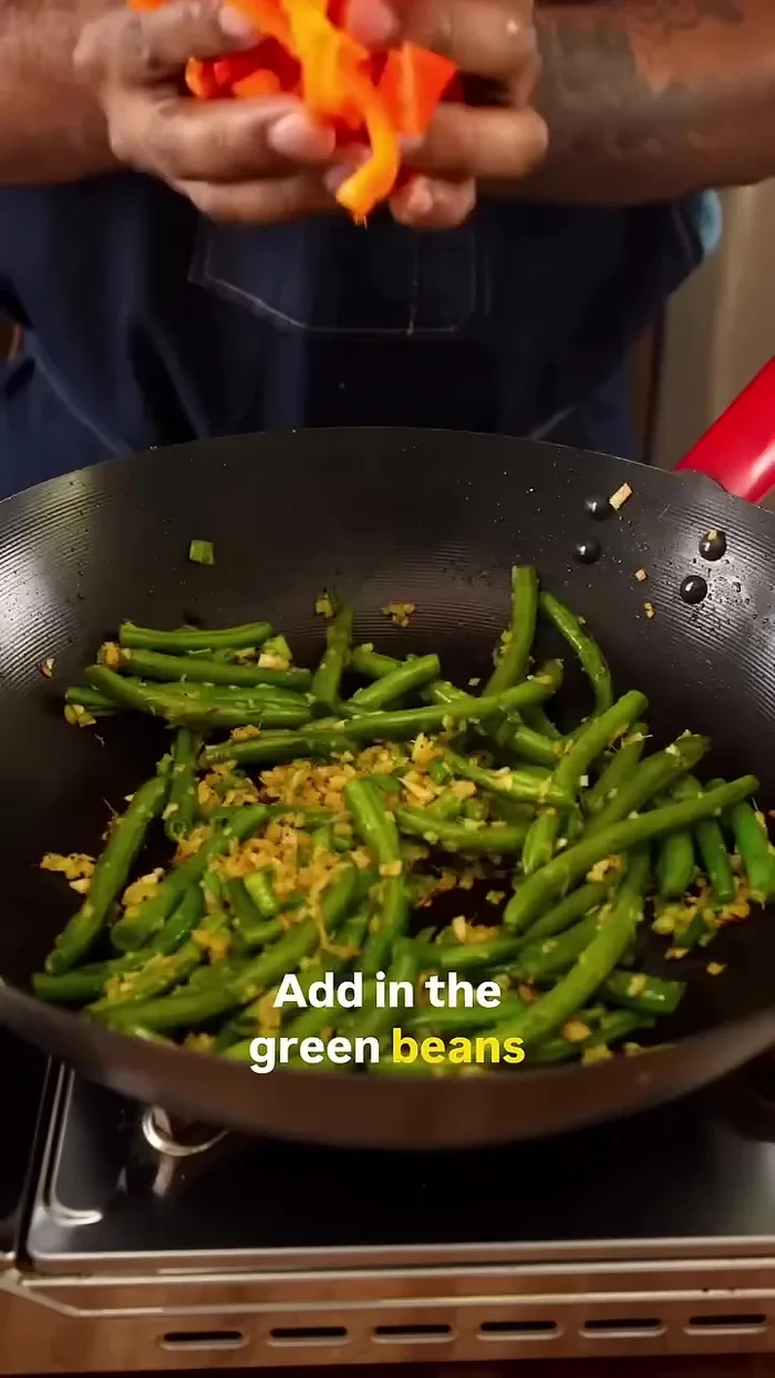 Add green beans, sliced bell peppers, and mangoes.
