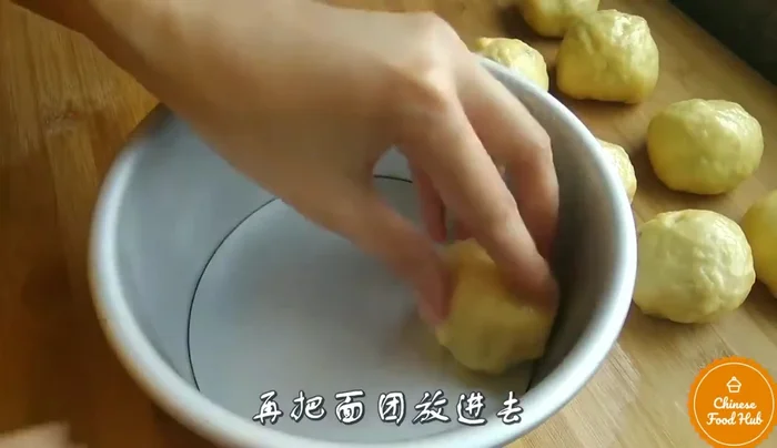 Bake the buns in a preheated oven until golden brown.