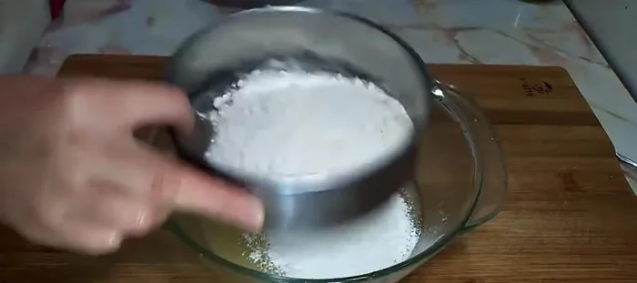 Arrange the mooncakes onto a baking sheet. (Inferred)