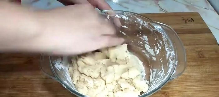 Bake the mooncakes in a preheated oven. (Inferred from the overall context)