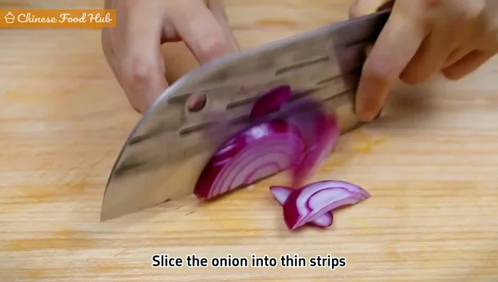 Slice onion into thin strips. Keep a bowl of water nearby to prevent eye irritation.