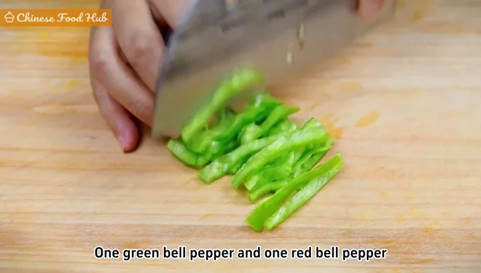 Slice green and red bell peppers into thin strips (or chili peppers if you prefer spicy).