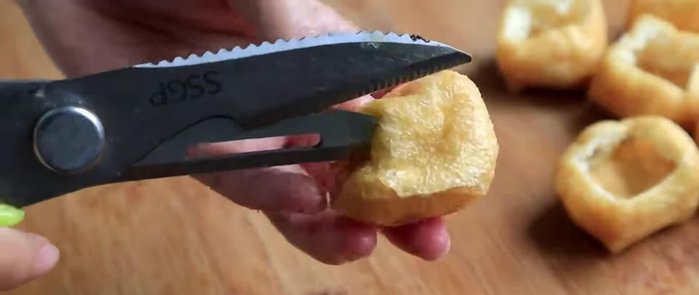 Prepare the tofu puffs. (Likely involves cleaning and possibly cutting a small opening)