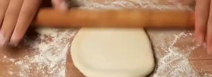 Roll each ball into a thin circle using a rolling pin.