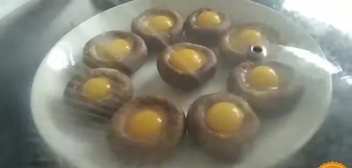 Place stuffed mushrooms in a steamer.