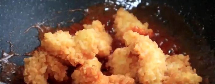 Add the fried shrimp balls to the sauce and toss gently to coat.