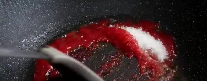 Add the chopped tomato, sugar, vinegar, and soy sauce. Simmer until thickened.