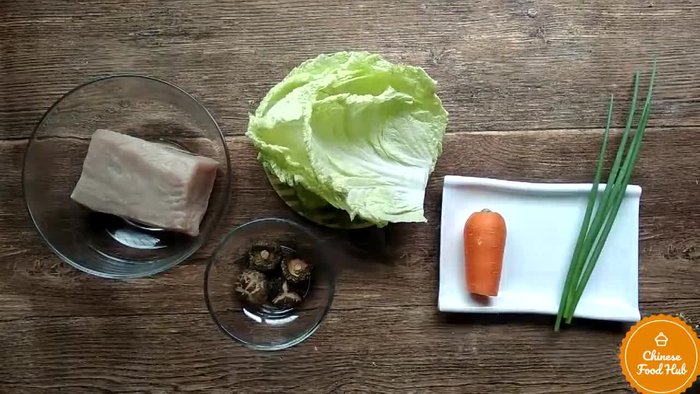 Prepare the cabbage filling: Finely chop cabbage, pork, garlic, and ginger. Mix with soy sauce, oyster sauce, sesame oil, and other seasonings.